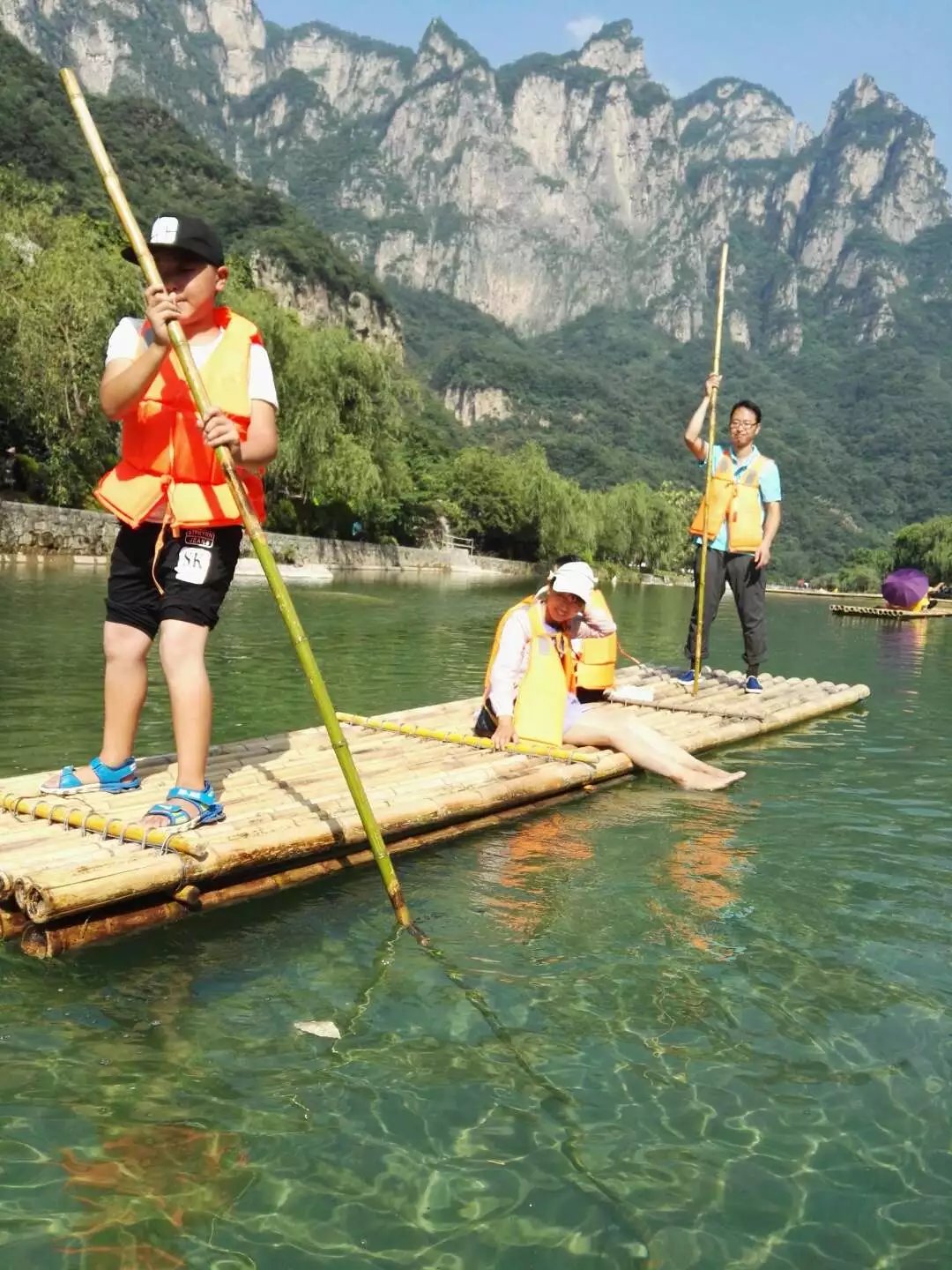 Small bamboo raft drifting in the picture