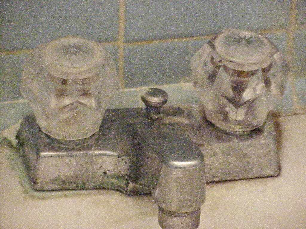 An old, cruddy faucet An old, cruddy faucet