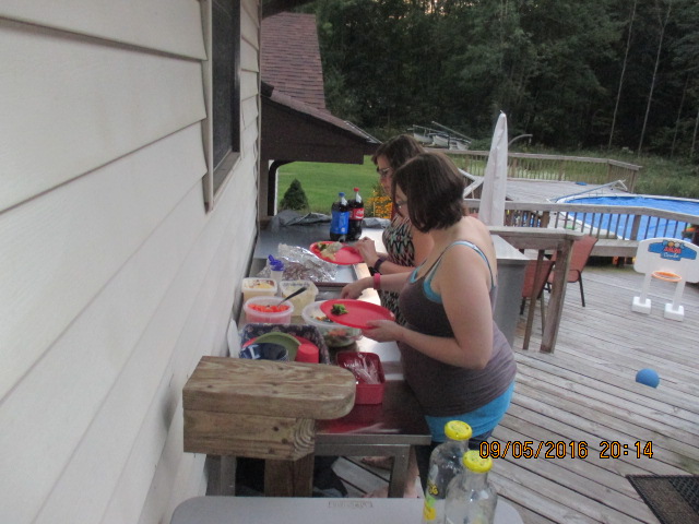 © Marsha Musselman 2016. My two daughters getting food with pool in background. © Marsha Musselman 2016. My two daughters getting food with pool in background.