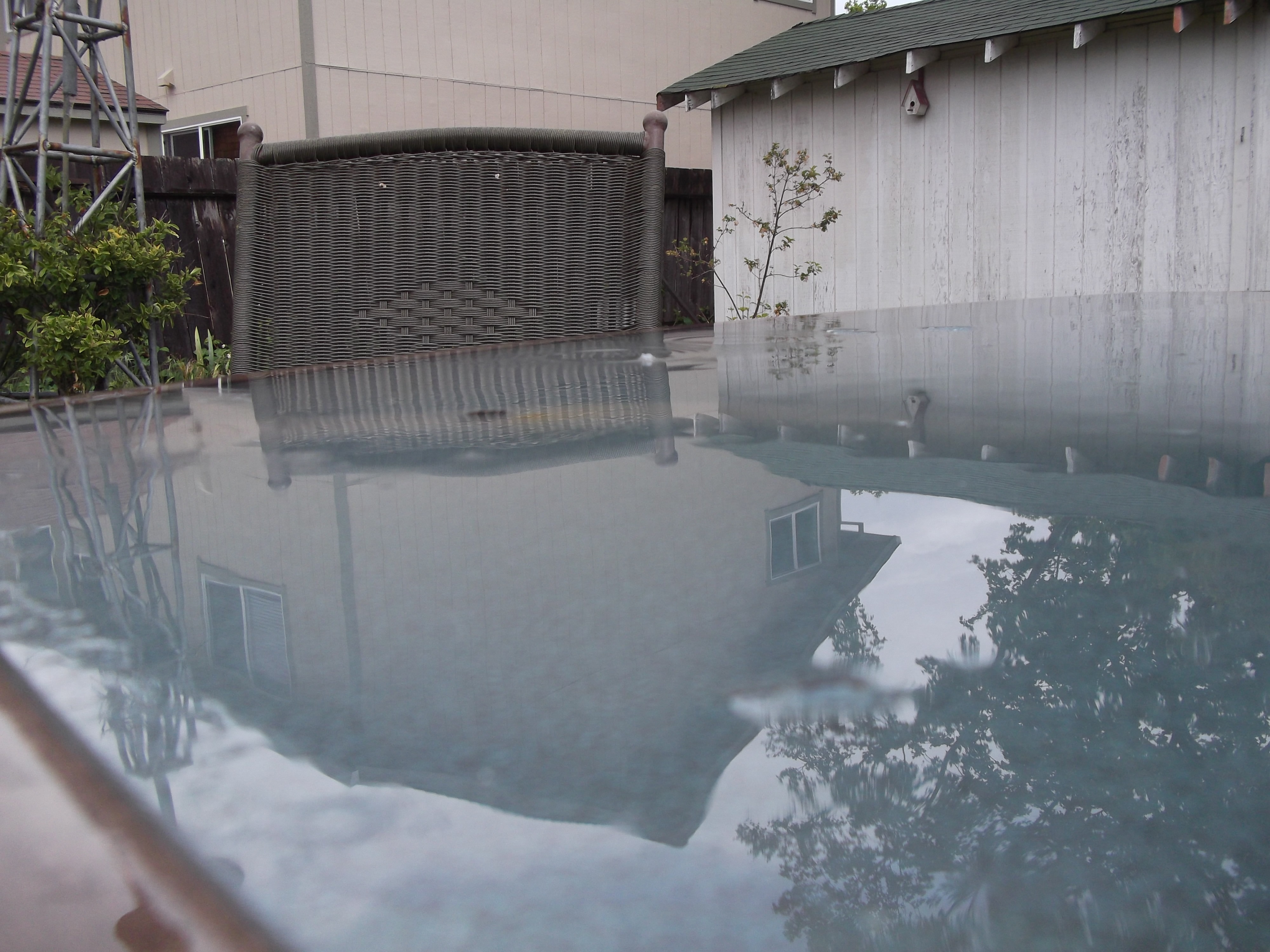 Photo I took of reflection of the neighbor&#039;s house in the water after the rain.