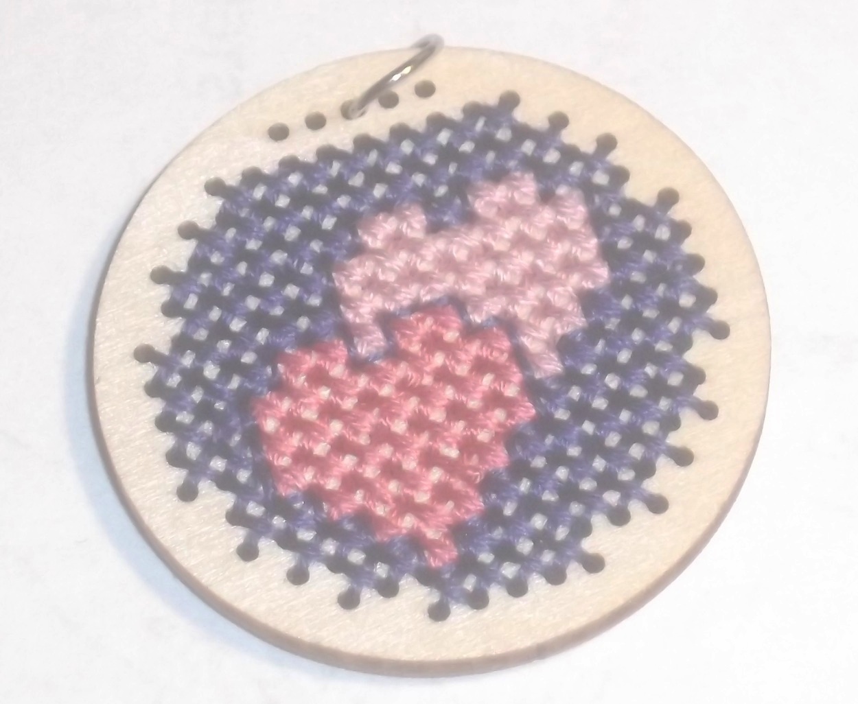 Counted cross stitch pendant created by me and with light adjusted on LunaPic.com Counted cross stitch pendant created by me and with light adjusted on LunaPic.com