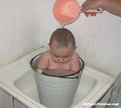 Budget Bath - Baby shoved in bucket, for bath time!