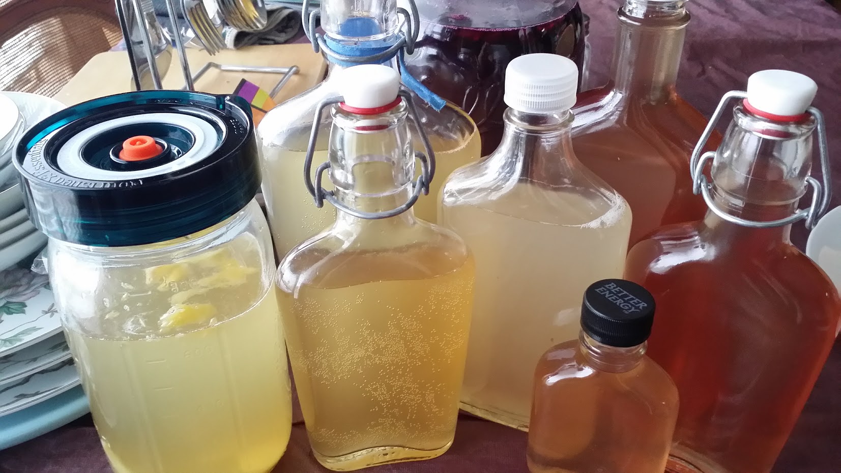 Different kinds of kvass, some showing the bubbles from carbonation.