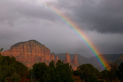 Sedona, Arizona - Here is a rainbow that is over Twin Buttes in Sedona Arizona. A very pretty picture. I have been to Sedona Arizona a lot of different times on vacation and retreats that I go on. It is a good get away from the city life and work.