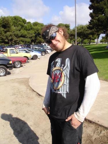 The Admiral - This is me. My cousin took this photo at a beach party in San Diego. I don't like those sun glasses, they're too big for me. I'm rockin' the crazy hippy/metalhead vibes in this one.