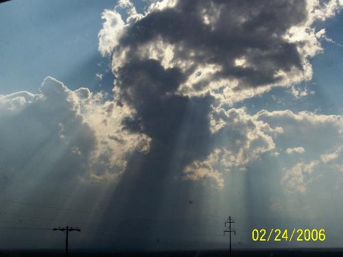Sky - My daughter does not see anything in this photo, but I do. I can see a lady's head shot, kinda like an angle, with her flowing hair; or maby even an indian. Maybe you can see something.