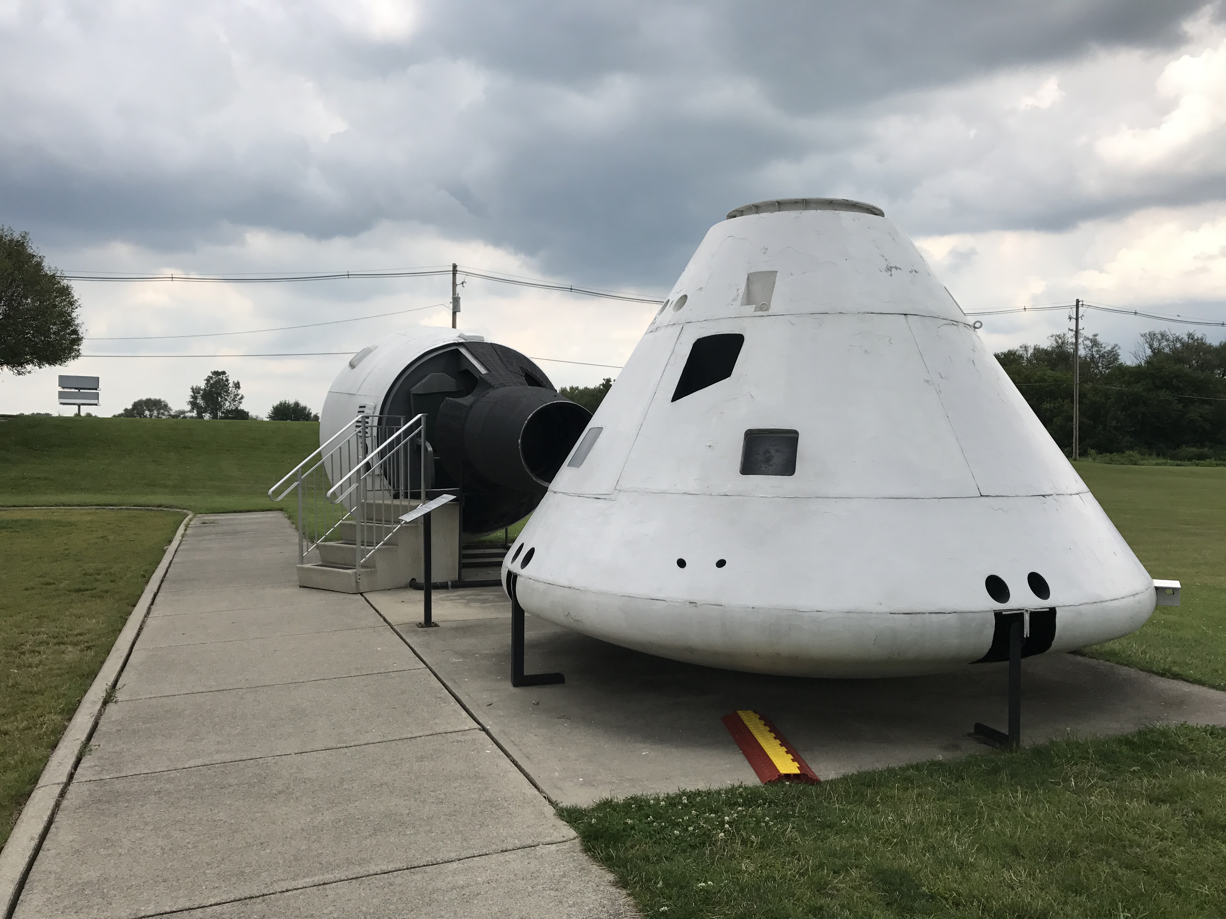 Replicas of the Apollo and Gemini command capsules at the Neil Armstrong Museum in Wapakoneta, Ohio.  Photo taken by and the property of FourWalls.