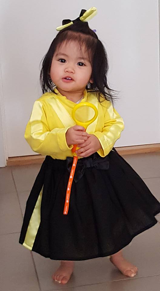 she loves her yellow wiggle costume ..