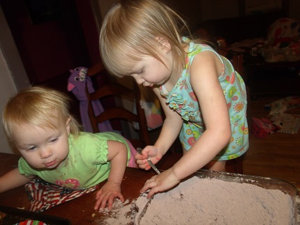 My older two daughters baking a brownie when they were younger My older two daughters baking a brownie when they were younger