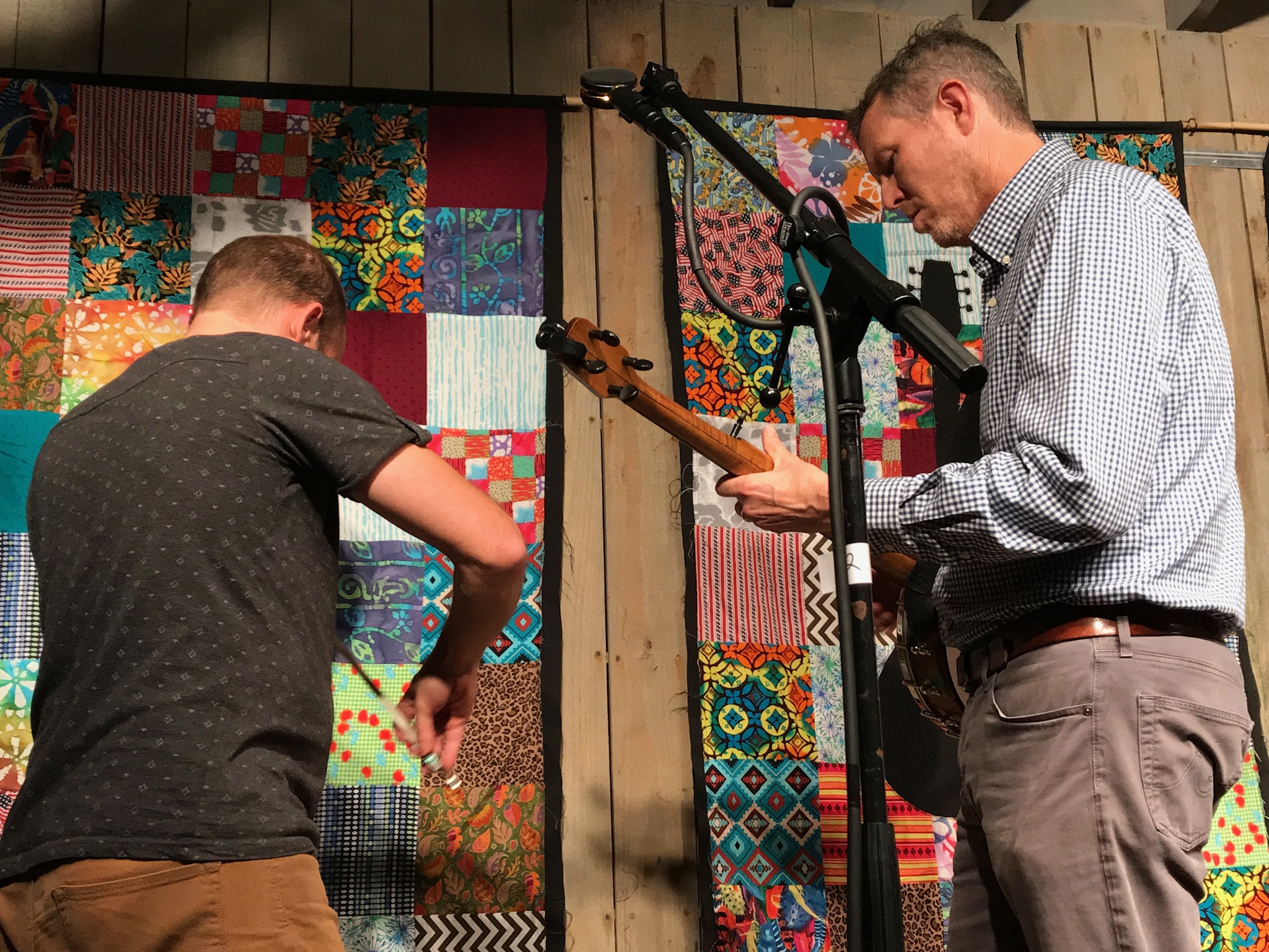 Shad Cobb and Robbie Fulks warming up for a fiddle and banjo duet at the start of the second set at the IBMM in Owensboro.  Photo taken by and the property of FourWalls.
