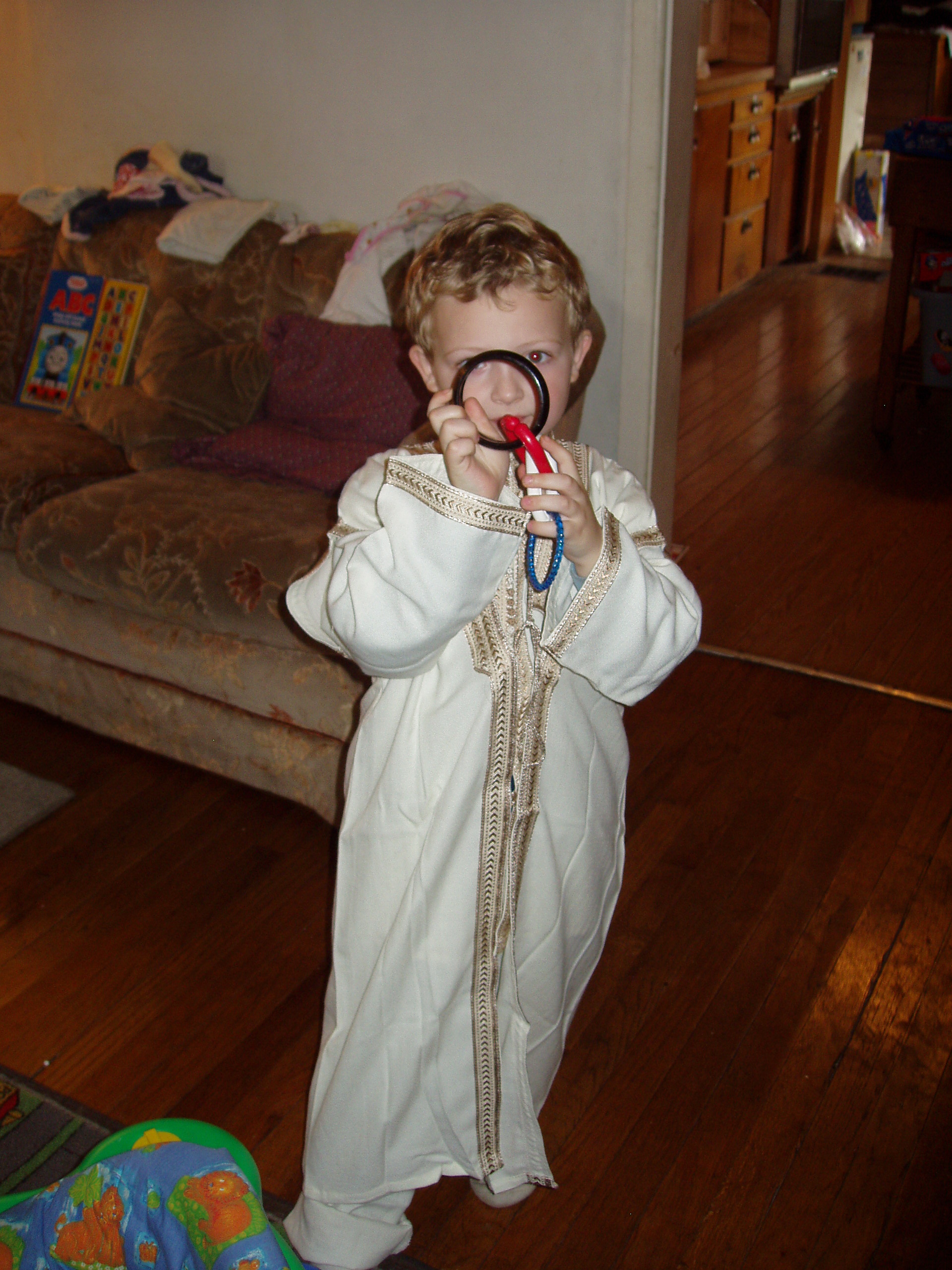 LittlePrince - A lovely picture of my son wearing his Eid outfit.  He looks angelic, yet playful here.