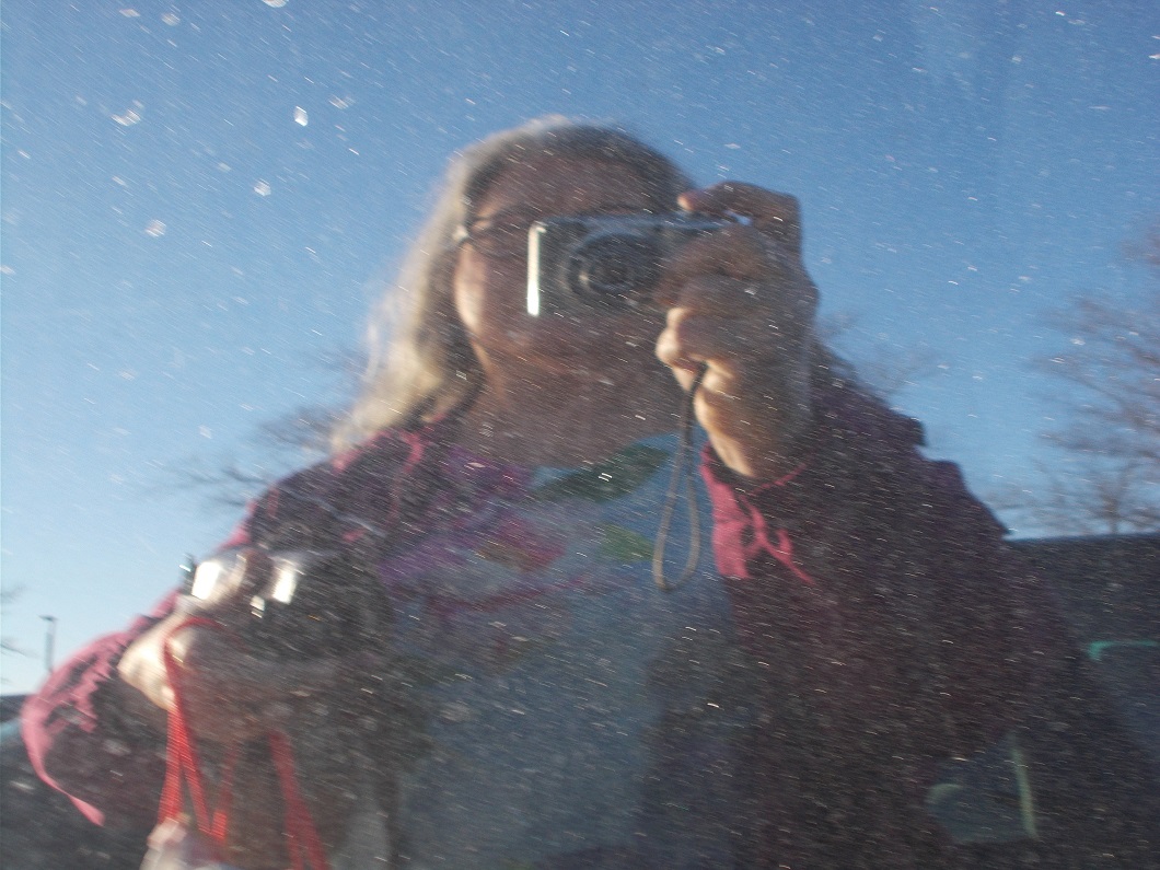 dirty car window reflection of me