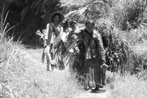 Back from the field - Today we upload a shot taken while having a lovely walk through the plantations and kitchen gardens. It was during these few hours a superb immersion in the daily life of these people.  The majority of the workers were women sometimes carrying their kids on the back.  Macro shot during the walk  We crossed these three women coming back to their home after a hard and daily work. We were suprised to see that contrary to usually, only the youngest was a little disturbed. The older ones were happy and smiling.  I know this is a classic ambigious situation for every tourist in such context, and I always wanted to apologize with my few Indonesia words for the disturbance, but how could we share these impressions and what we see without these shots.....  I reposted the shot in B&W better to fix this scene in the Time...well it's a personal feeling