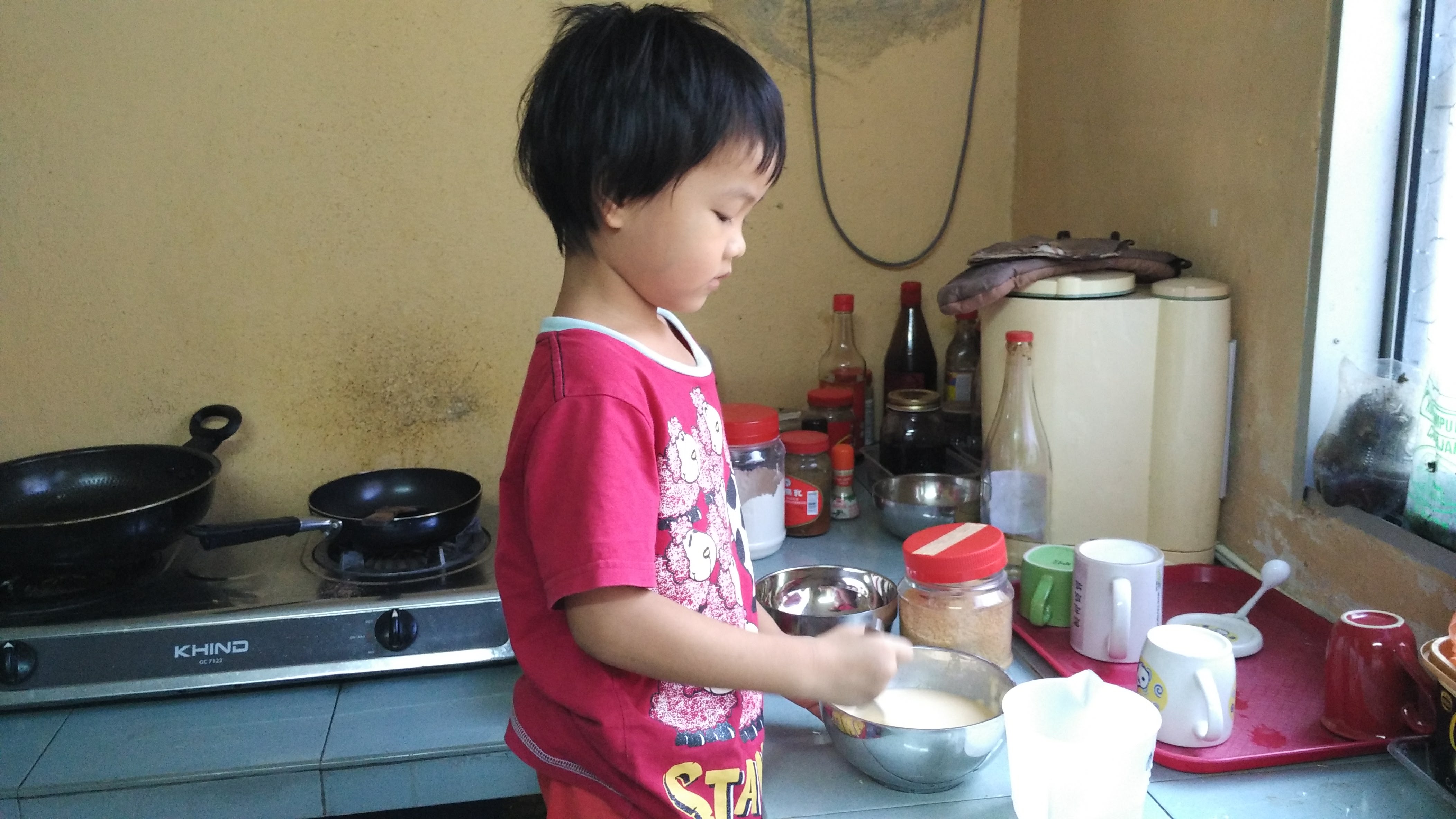 My little girl preparing the pancake My little girl preparing the pancake