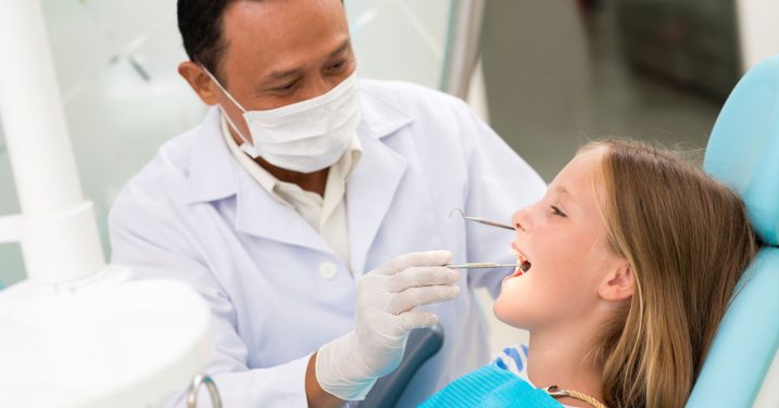 A dentist with a kid