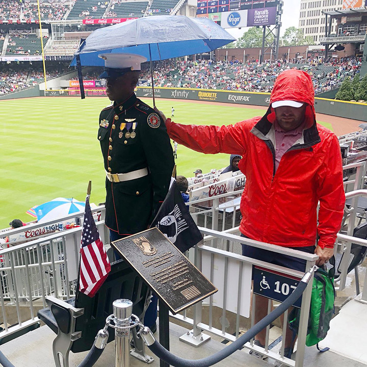 Atlanta Braves fans shows respect for a JROTC Marine cadet. Atlanta Braves fans shows respect for a JROTC Marine cadet.