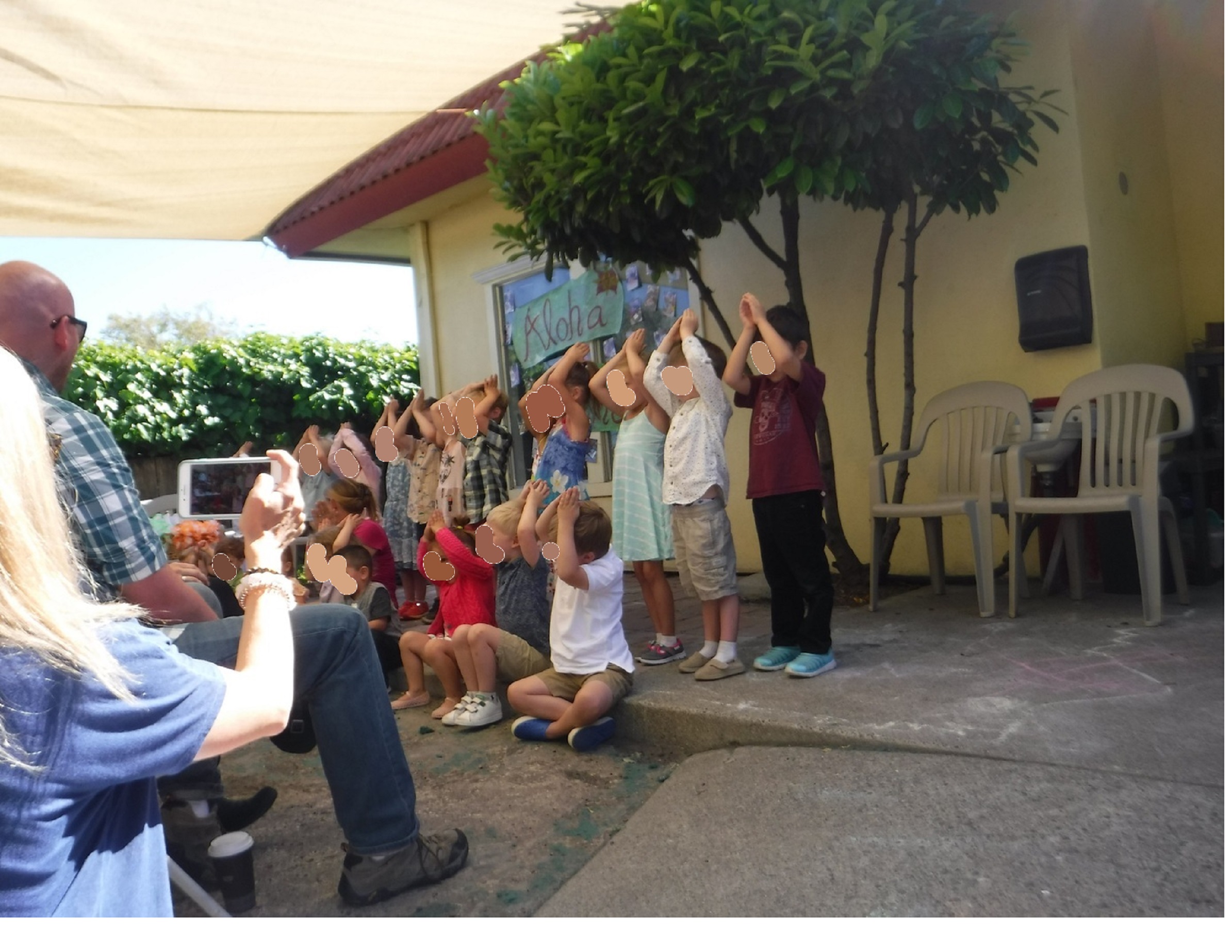 Photo I took of the Preschoolers singing one of their songs at their graduation Photo I took of the Preschoolers singing one of their songs at their graduation