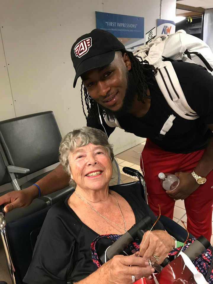 Green Bay Packers Aaron Jones and a Packers fan. Green Bay Packers Aaron Jones and a Packers fan.