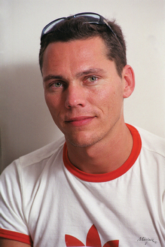 DJ Tiesto - Tijs Verwest (born January 17, 1969 in Breda, Netherlands), or better known under his artist name DJ Tiësto or Tiësto, is one of the world's most famous trance DJs and famous figure in the electronic dance music scene. Although he has used many aliases in the past, he is best known for his work as DJ Tiësto. However, his latest productions have him dropping the 'DJ' label and he is now known simply as 'Tiësto'.  In Europe, Tiësto is best known for his famous remix of the Delerium single Silence (featuring Sarah McLachlan) and for his remix of William Orbit's interpretation of Samuel Barber's Adagio for Strings. Tijs will be permanently attached to his Tiësto alias, an Italian twist of his childhood nickname, and this acclaimed remix that brought him into the strata of world-renowned DJs. As of May 2006 Tiësto is the official worldwide ambassador for the Dance4Life foundation, fighting the spread of AIDS/HIV, for which he recorded the track 'dance4life'.