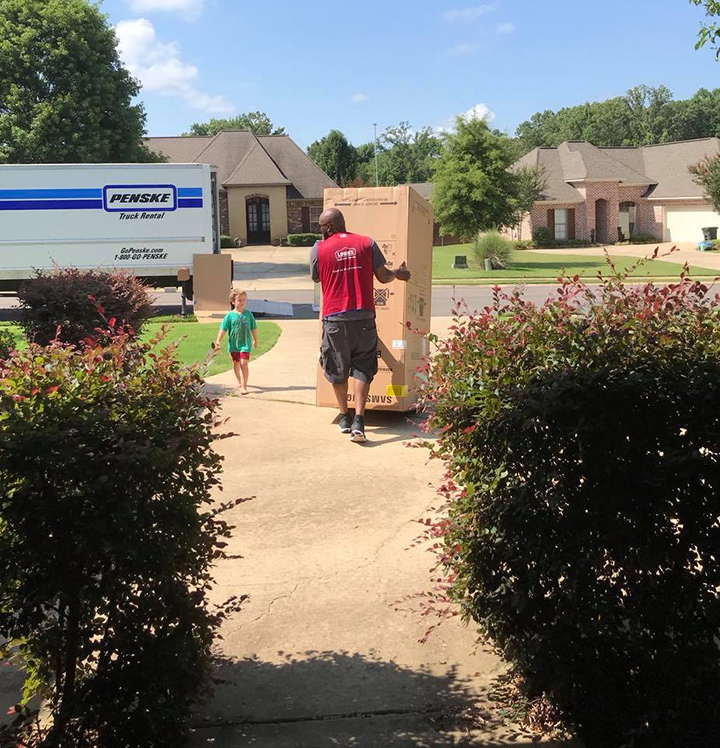 Lowe's delivery driver brings a box to the home of Wendy Bailey Lowe's delivery driver brings a box to the home of Wendy Bailey