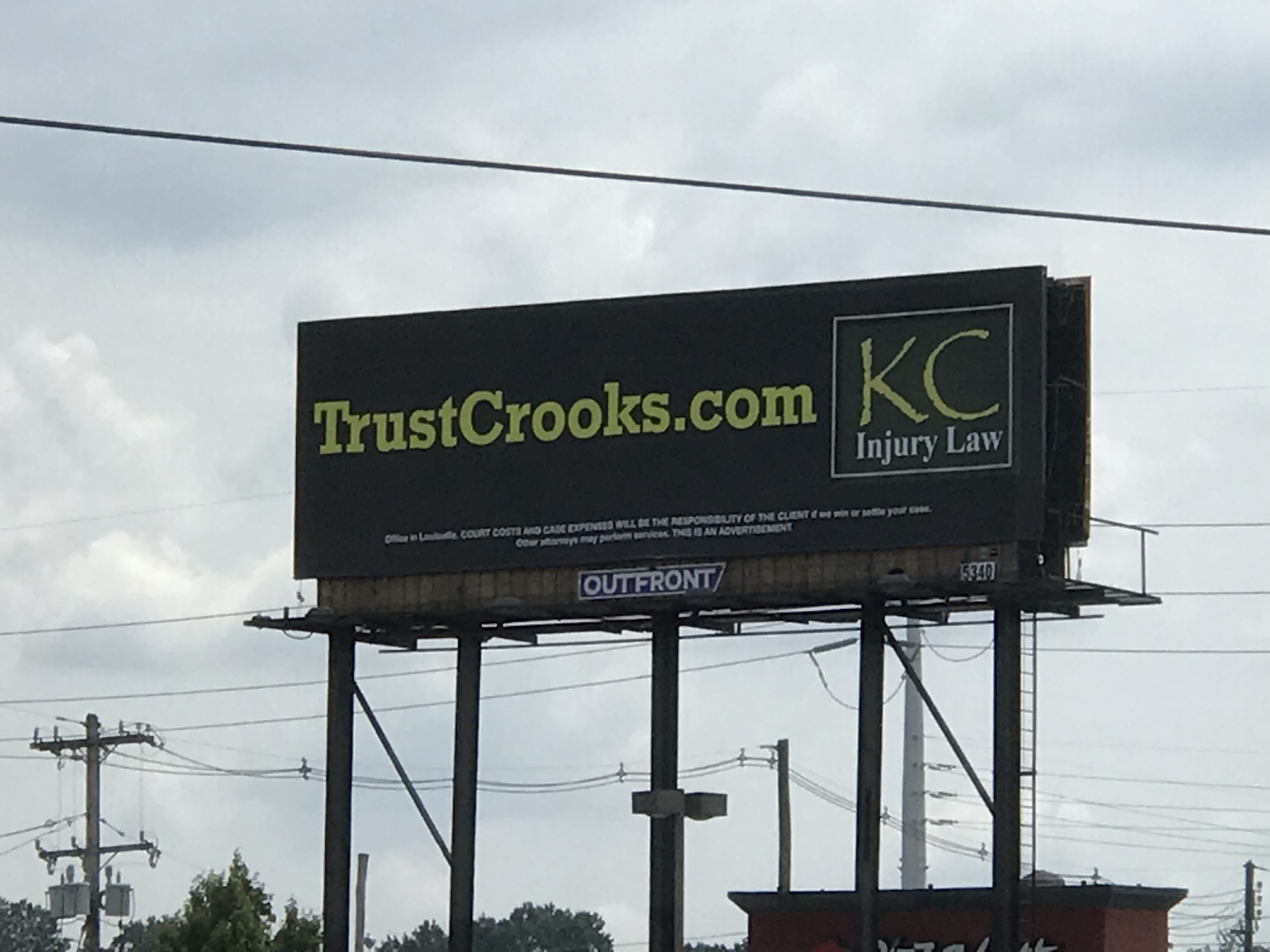 Local lawyers’ billboard.  Photo taken by and the property of FourWalls.