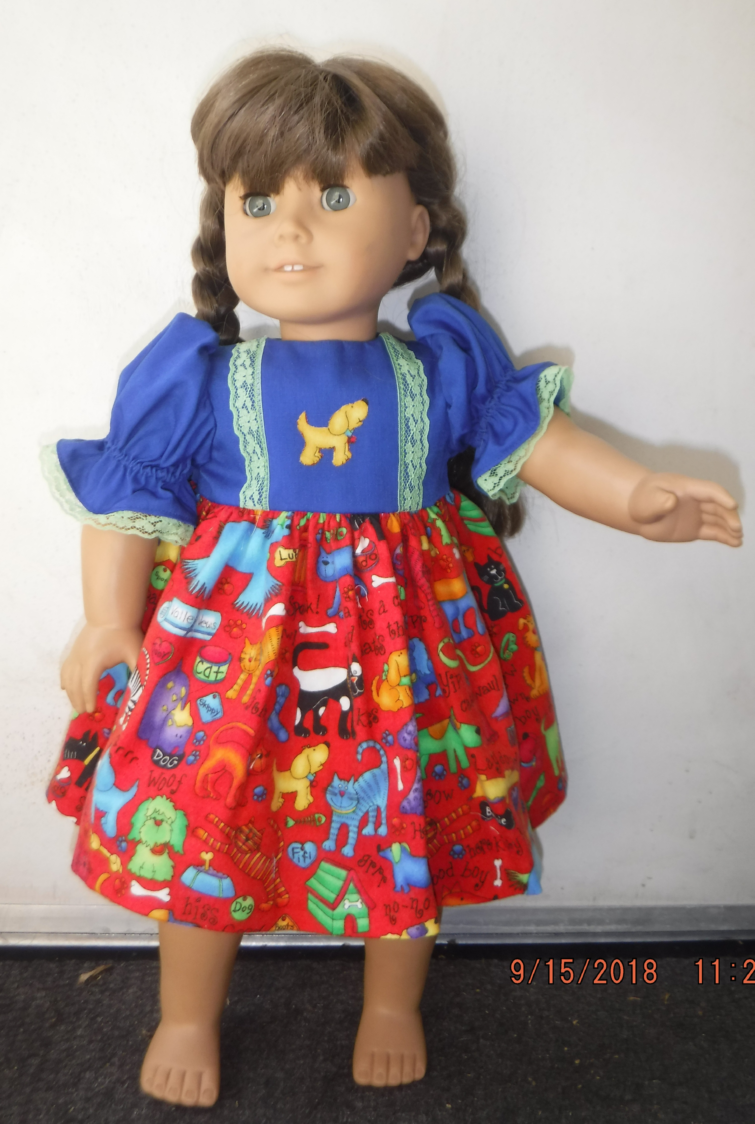 Photo I took of my Mom's doll and a dress that she made Photo I took of my Mom's doll and a dress that she made