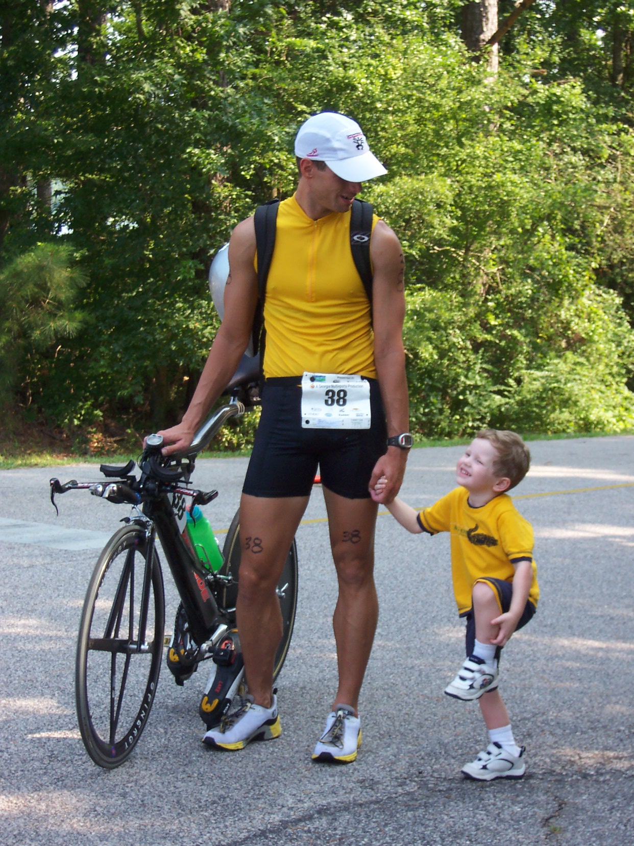 A Boy And His Hero - My son and his uncle, my brother.  My brother does IronMan Triathlons and we try to make it to as many of his races as we can.  This was in Georgia about a year and a half ago.  It was pure coincidence that they were wearing the same color, but my boy has always said that his uncle is his hero, and you can certainly get a glimpse of that in this photo.
