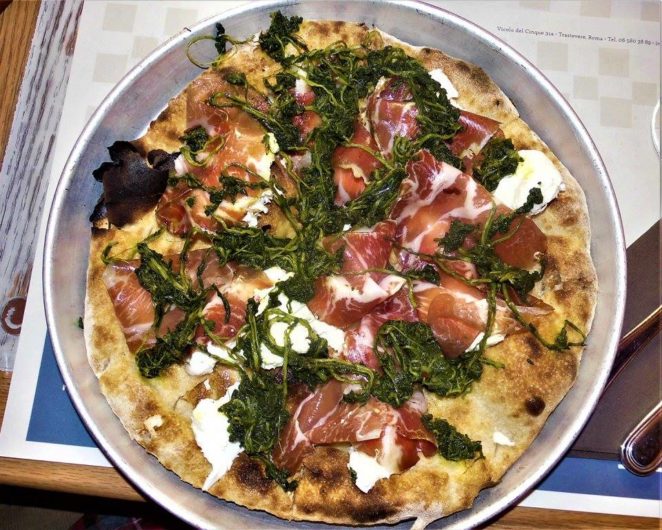 Focaccia topped with pork neck pickled in white wine, soft white cheese, and steamed dandelion greens 