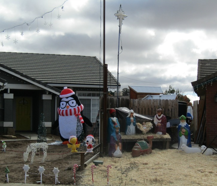 Yard Decorated for Christmas with Contrast of Secular and Sacred Decorations