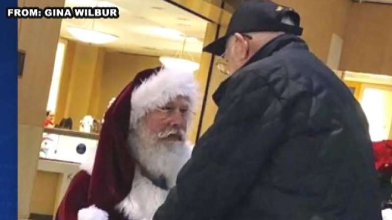 Santa Claus thanking a World War II veteran for his service Santa Claus thanking a World War II veteran for his service