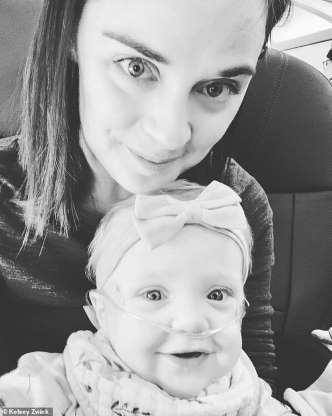 Lucy and her mother Kelsey are grateful for a passenger who gave up his seat Lucy and her mother Kelsey are grateful for a passenger who gave up his seat