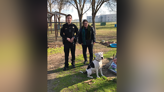 A police officer from the San Joaquin County and the owner of a lost dog A police officer from the San Joaquin County and the owner of a lost dog
