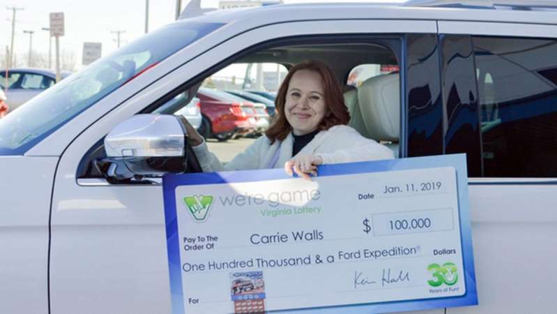Carrie Walls and her new Ford auto and $100,000 dollars won in a lottery Carrie Walls and her new Ford auto and $100,000 dollars won in a lottery