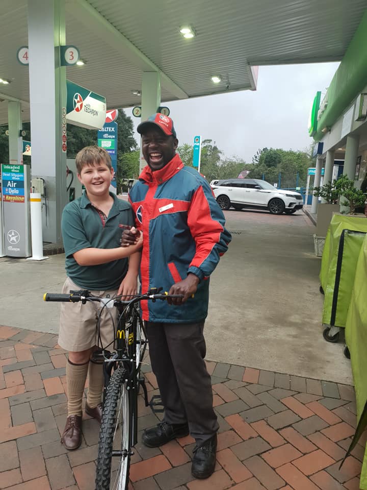 Vaughn Fish (left) and his friend Tony at a gasoline station in South Africa