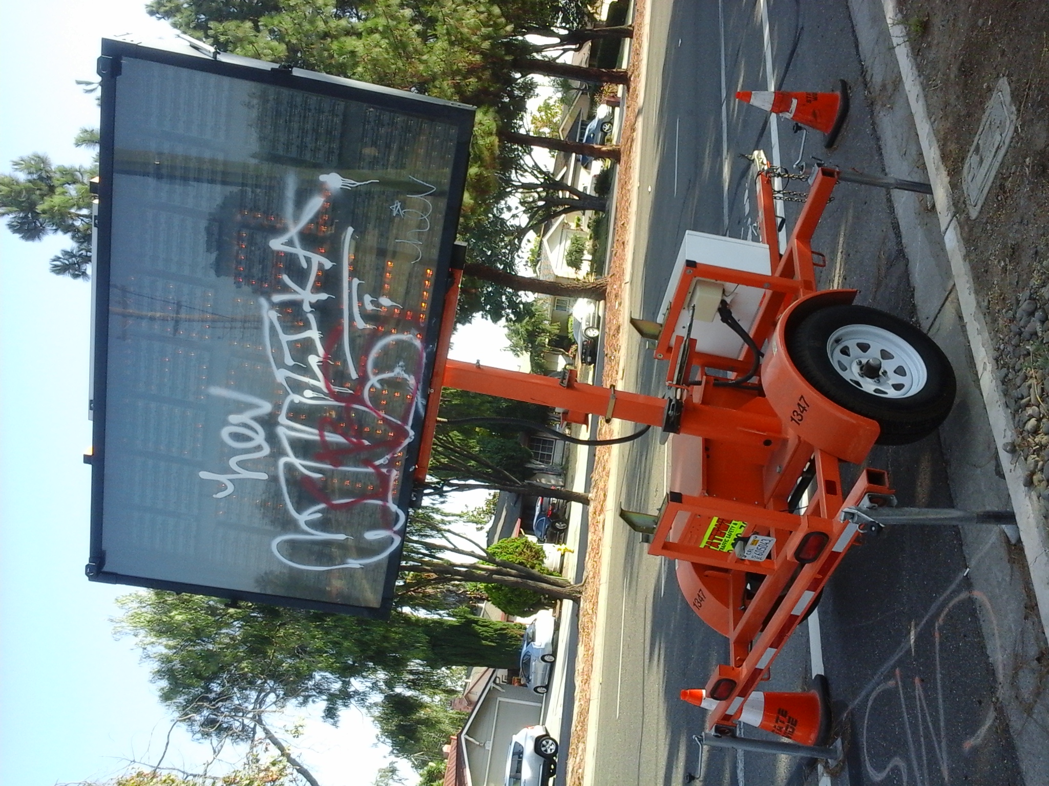 weird place to make graffiti on a utility signal vehicle