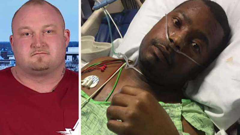 Ryan Belcher (L) being called a hero for using his strength to save a life Ryan Belcher (L) being called a hero for using his strength to save a life
