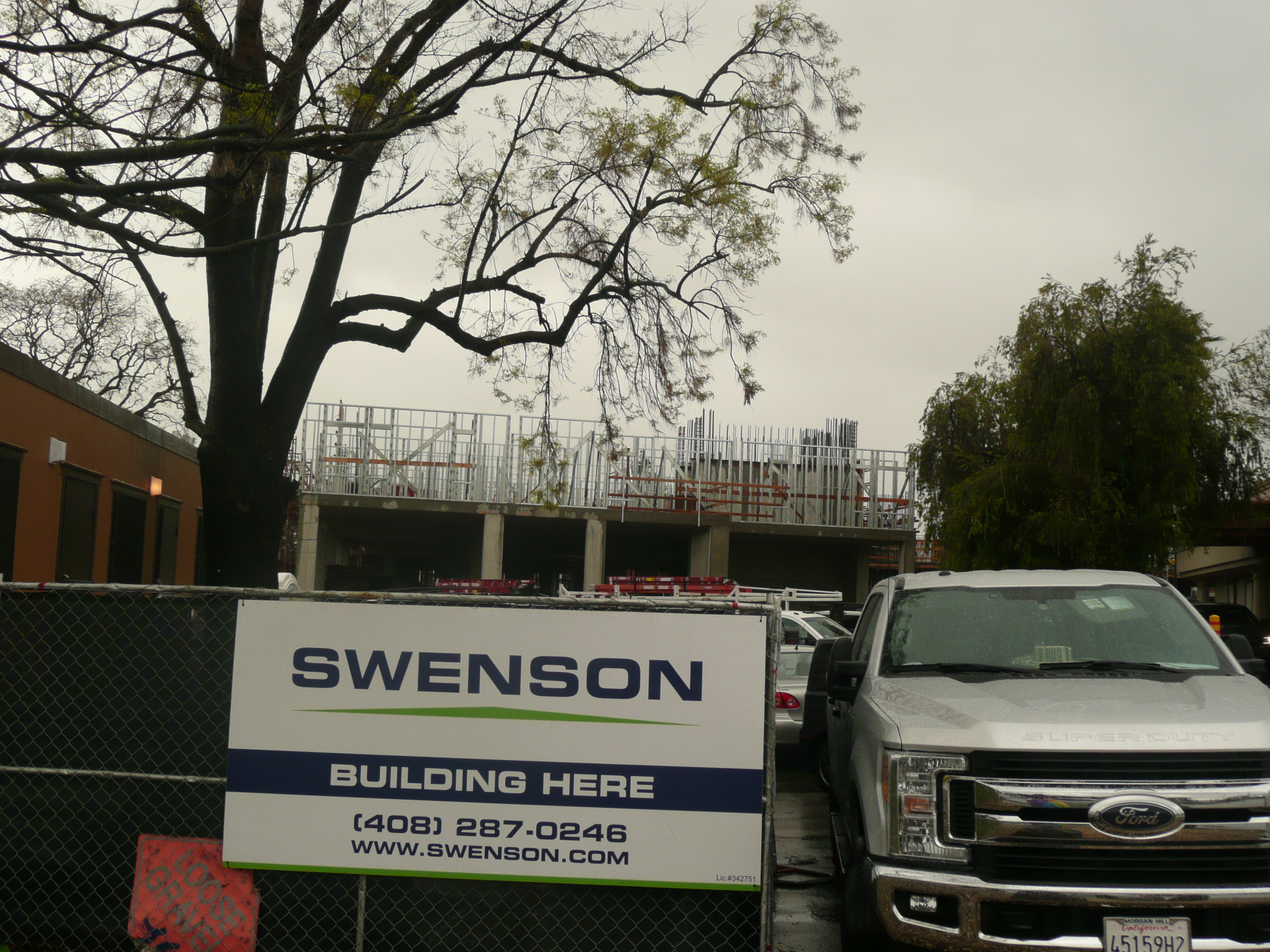 construction site,building,workers,construction,inclement weather