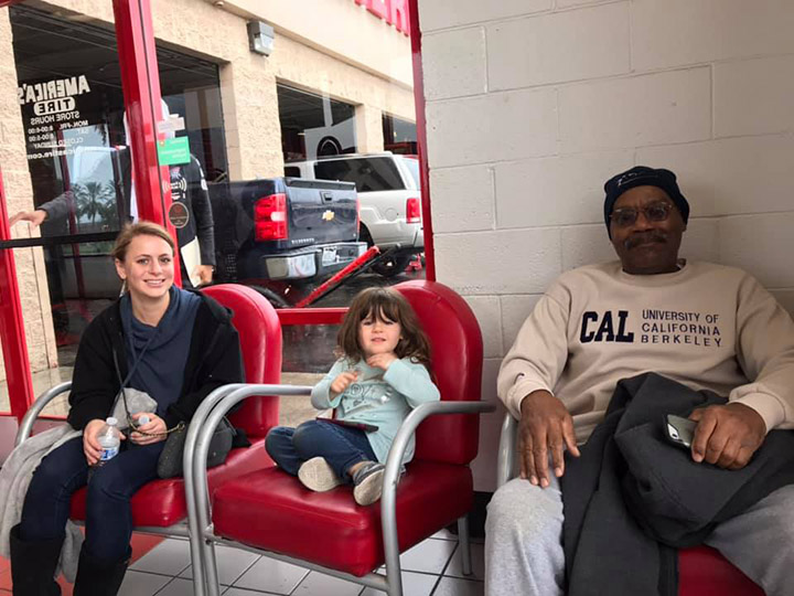 Alex (L) with her child and Phil who paid her tire bill of $1,400 dollars 