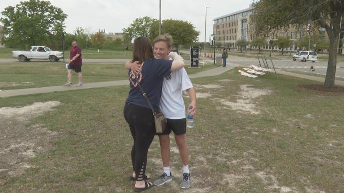 Sarah Smith hugging her fellow student Evan Cure Sarah Smith hugging her fellow student Evan Cure