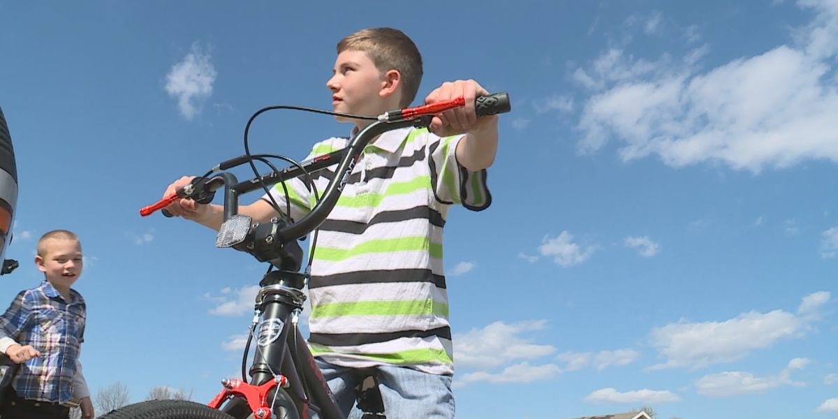 Ryan Dempster receives a new bicycle from a Good Samaritan