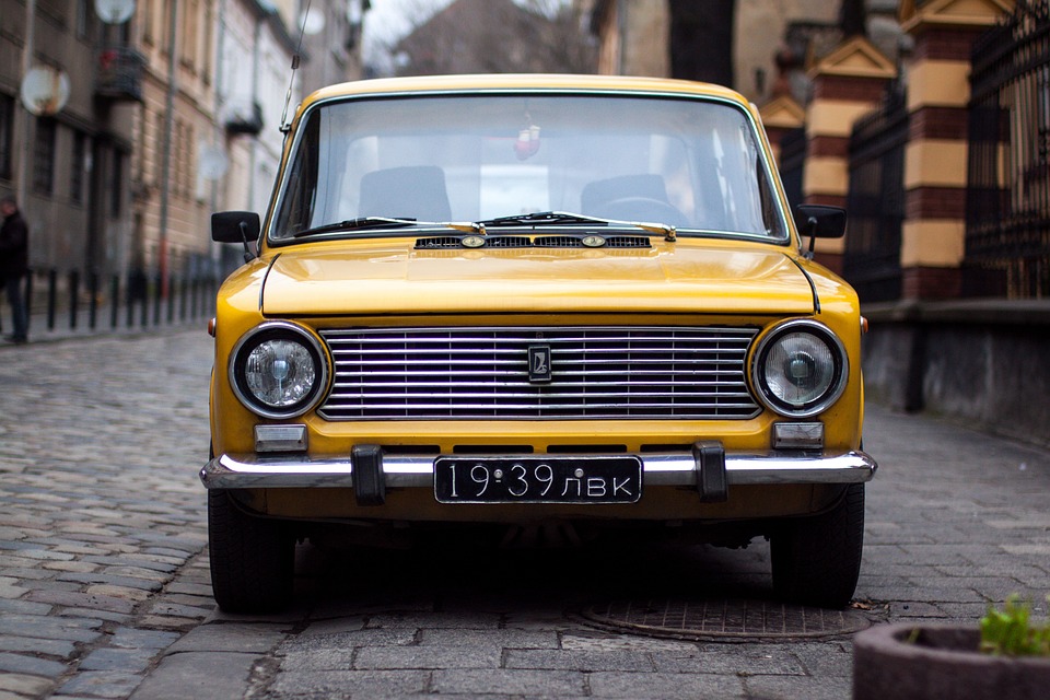 Fredas little yellow car parked outside of the bank Fredas little yellow car parked outside of the bank