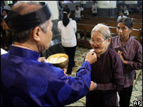 Catholic Priest Jailed  - Christians in Hanoi clearly feel that progress has been made.  'My parents had some difficulties in the past,' said 22-year-old Do Duy Nghin, one of Vietnam's six million Catholics. 'People they knew were banned from going to church at one point, and some priests were even jailed. 'But now I feel free and comfortable to worship the way I want.'  It appears that the days when the Communist authorities attached a stigma to religion are now over.   People walk freely in and out of churches and Buddhist temples - some of which have been newly built in the last few years - and believers openly wear pendants and carry other symbols of their faith.  But critics say the authorities continue to restrict the activities of any religious organisations deemed to be at odds with state policy.  According to the US Commission on International Religious Freedom, 'severe restrictions on religious freedom and abuses continue,' with 'forced renunciations of faith' taking place in some areas. In a statement expressing her disagreement with Washington's decision to remove Vietnam from its blacklist, commission chairwoman Felice Gaer said the government remained 'highly suspicious' of certain groups from the rural highlands.  These groups include the ethnic minority Protestants from Montagnard and Hmong communities, as well as the banned Unified Buddhist Church of Vietnam (UBCV).