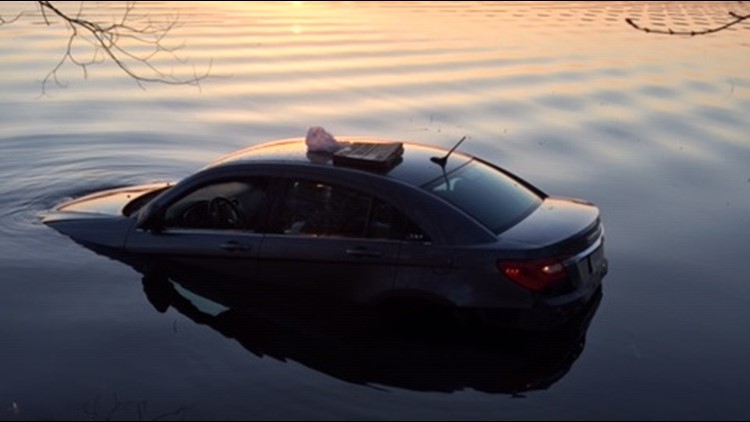 A Chrsyler auto partially submerged in Lower Spunk Lake in Minnesota