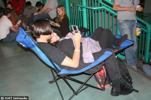Game playing - One way to stay warm in line was to cozy up with a friend and play some games.