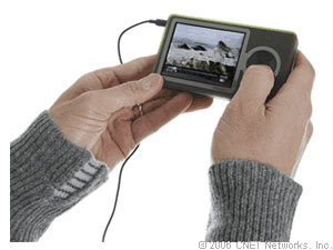 Zune - The good: The Microsoft Zune has very good playback performance of audio, video, and photos; intuitive and colorful interface; good FM radio with RDS; works well with Zune Marketplace software; integrated wireless allows sharing of songs (limited) and photos; many accessories available at launch. The bad: The Microsoft Zune is not backward compatible with WMA-DRM9; weak native video support (cannot play protected content) and no video offerings from Zune Marketplace; cannot be used as a hard drive (and no UMS support); proprietary USB; cannot use Wi-Fi to sync, stream, or purchase content; minimal bundled accessories; no podcast directory; maximum capacity is 30GB. The bottom line: The Microsoft Zune with its intuitive interface and solid playback performance will please most users. But lukewarm format support and the cool but limited Wi-Fi capability will have advanced users seeking more. The Zune is a very good start, though.