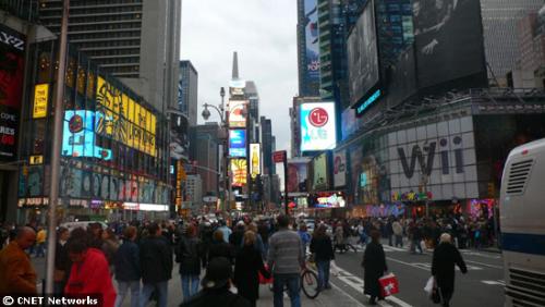 waiting - Times Square was abuzz with Wii fever on Saturday as the Toys 'R' Us store prominently advertised the video game console release.