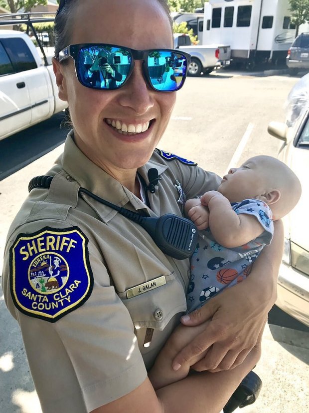 Santa Clara County Sheriff Officer Jennifer Galan holding Oscar Santa Clara County Sheriff Officer Jennifer Galan holding Oscar