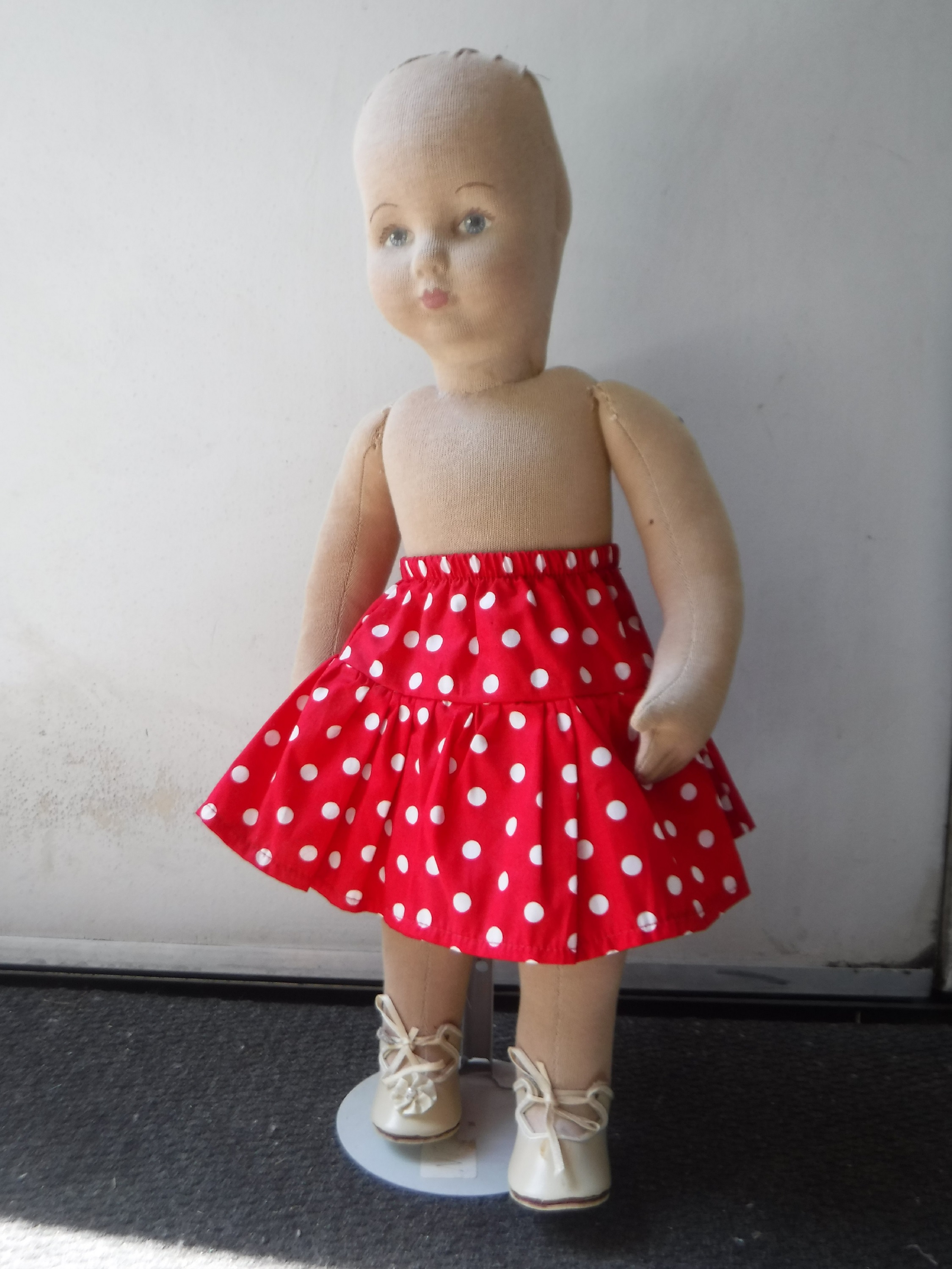 Photo I took of the skirt my mother made on a doll she also made Photo I took of the skirt my mother made on a doll she also made
