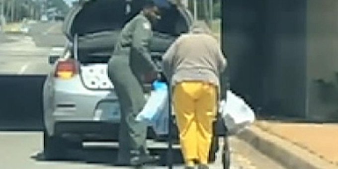 A U S Air Foce serviceman does his part to assist someone in need.