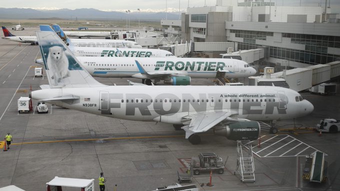 Frontier Airlines flight attendant Joel Castro doing his duty Frontier Airlines flight attendant Joel Castro doing his duty